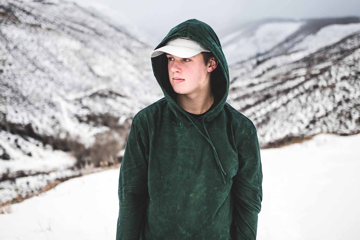 a person in a hoodie in the snow